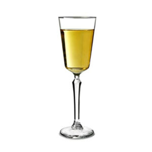 Filled SPKSY champagne glass by Libbey.