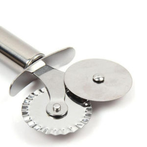 A close-up of a 2-way dough cutter.