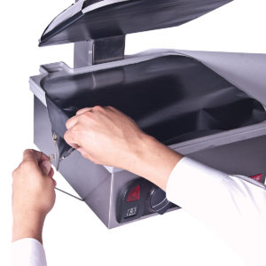 Fastening the teflon toaster cover to a flat plate toaster by Anvil.